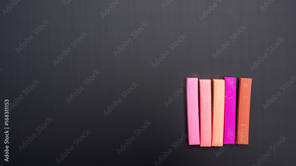 chalk pastels on a school blackboard for a background. chalk pastels on a school blackboard for a background.