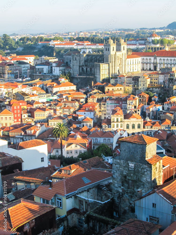 Cityscape of Porto, Portugal, viewed from the Torre dos Clerigos - buildings, traditional houses and landmarks in sunset light