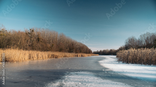 panorama of frozen river winter landscape