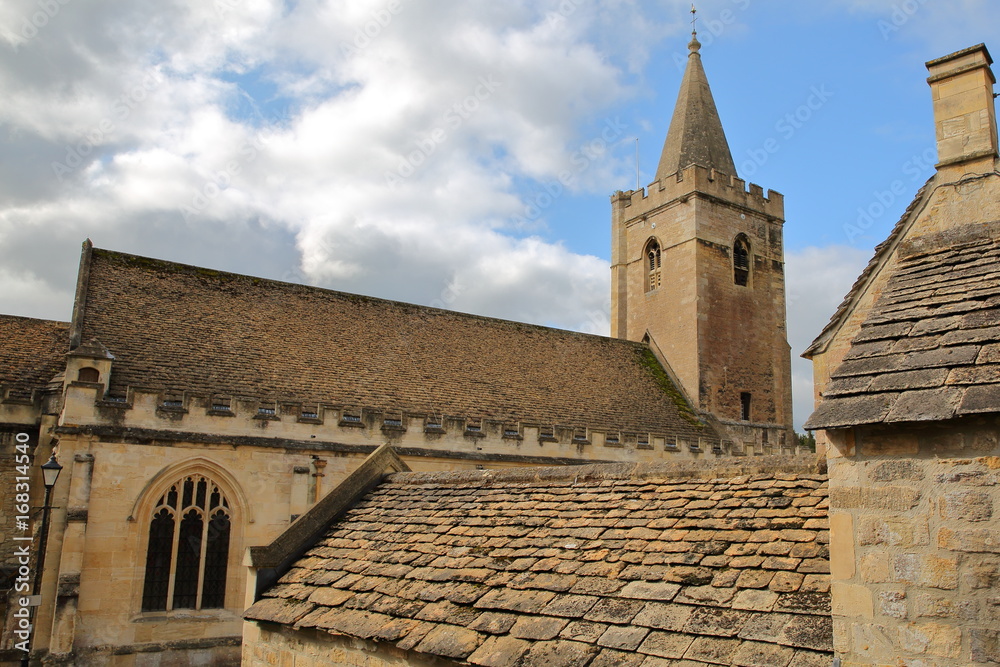 Holy Trinity Church with traditional stone roofs in the foreground, Bradford on Avon, UK