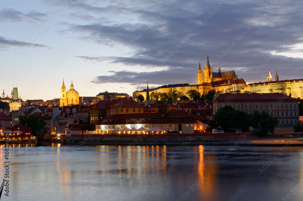Czech Republic, Prague, Night view on Hradcany castle.Beautifully lit castle and Vltava river in the foreground.
