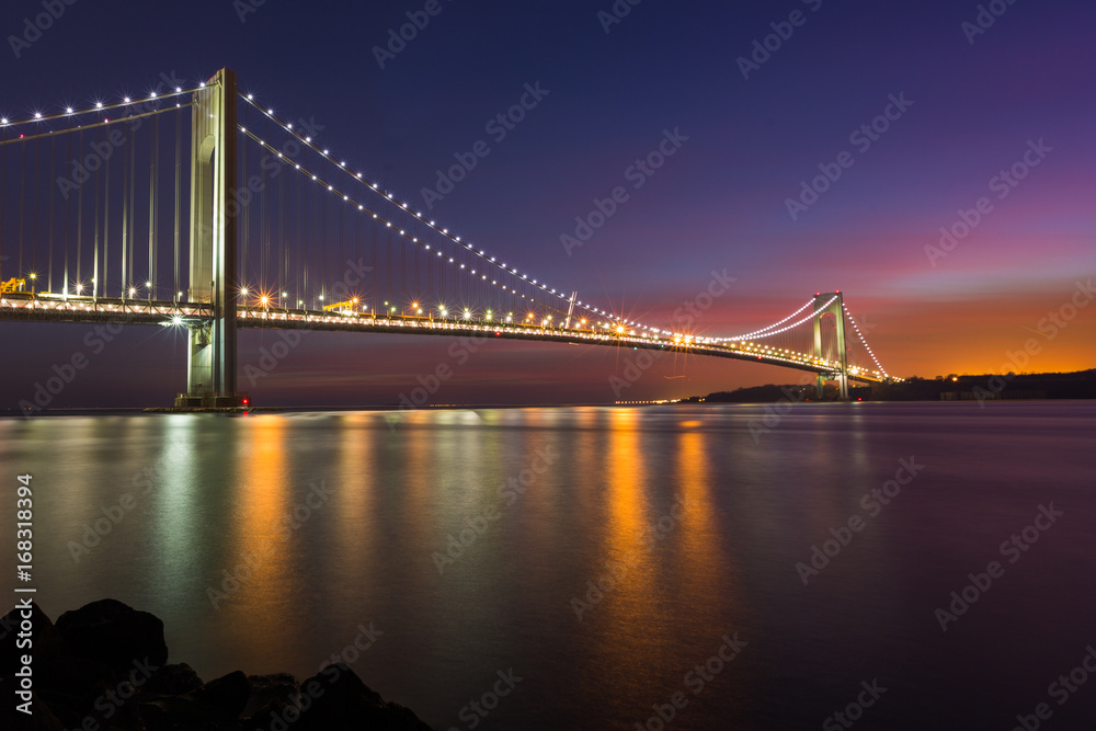 Fototapeta premium Colorful sunset sky at the Verrazano Narrow Bridge, New York.