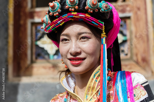 A girl dressed in national costume in Badan County,Sichuan province,China photo