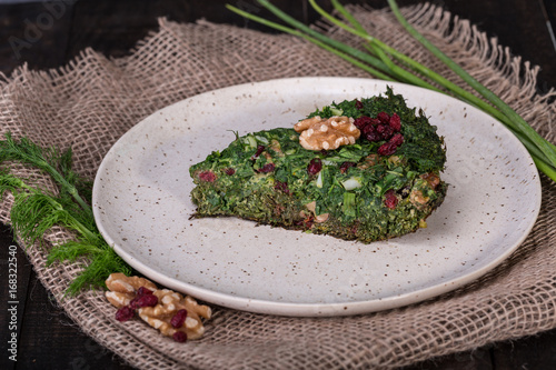 Persian Mixed herbs frittata with barberry and walnut Kuku and Zereshk photo