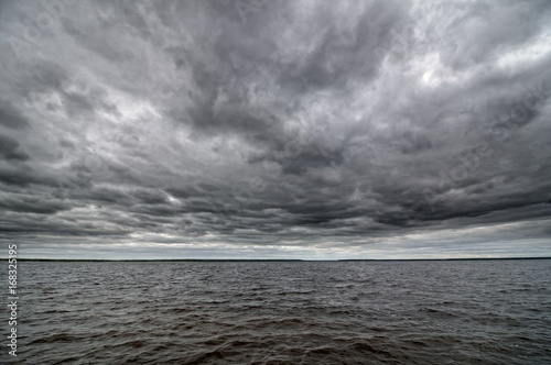 Dark cloudy sky and water