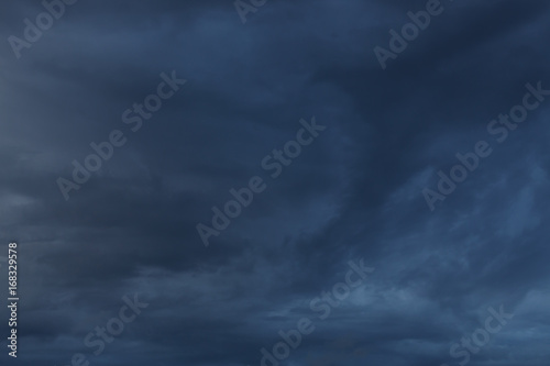 dramatic moody dark storm cloud sky used image for a bad day background © sutichak