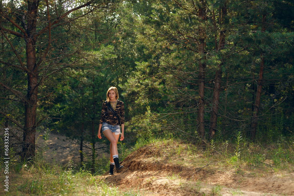 Pretty tourist girl walking in forest Pretty tourist girl walking in forest