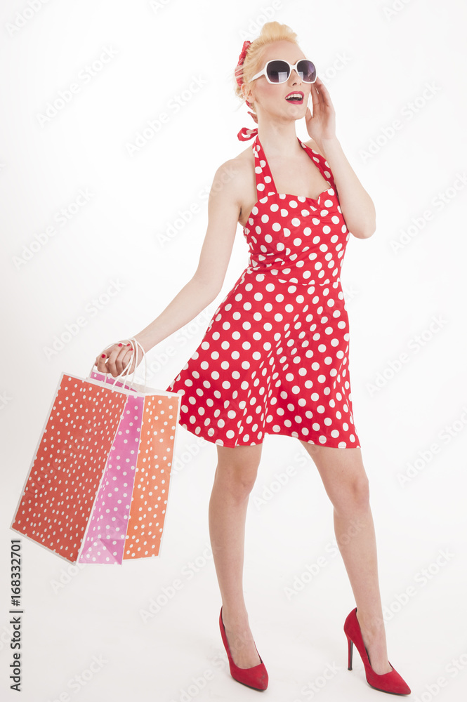 Retro pin up girl shopping. Woman holding paper bag Retro pin up girl shopping. Woman holding paper bag