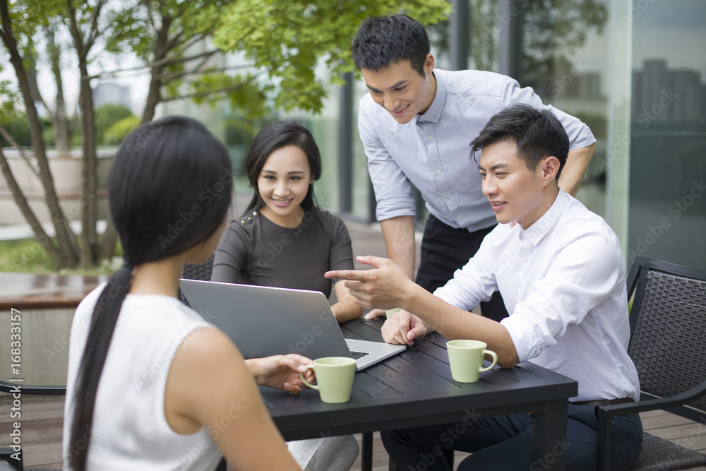 Young business people having a meeting outdoors Young business people having a meeting outdoors