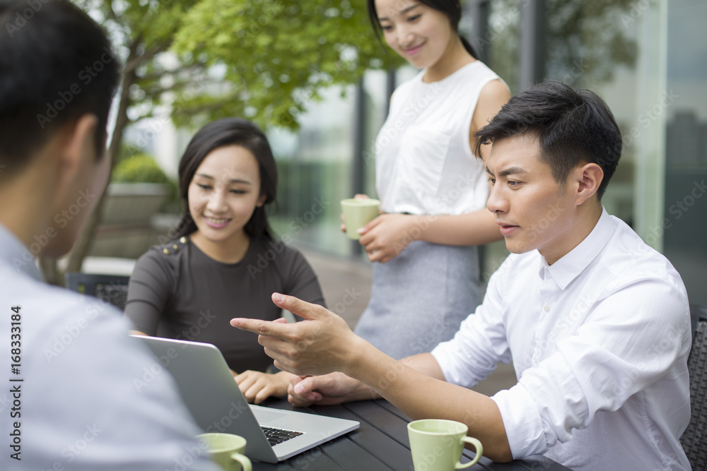 Young business people having a meeting outdoors Young business people having a meeting outdoors