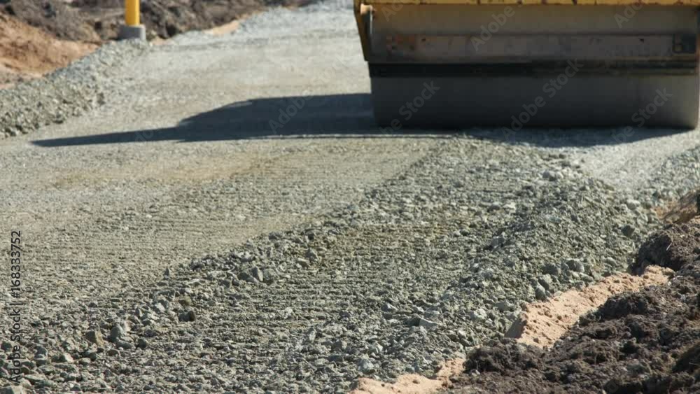 Vibratory roller on road construction site Vibratory roller on road construction site