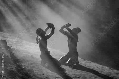 Muay thai, Black and White Thai Boxer training in sunset background,Thai boxer culture,Thailand photo