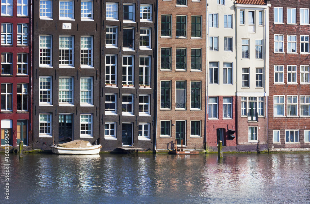 Amsterdam buildings on channel. 