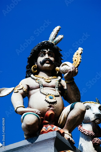 Statue Hindu deities on the roof of temple within Batu Caves. Batu Caves - a complex of limestone caves in Kuala Lumpur, Malesia photo