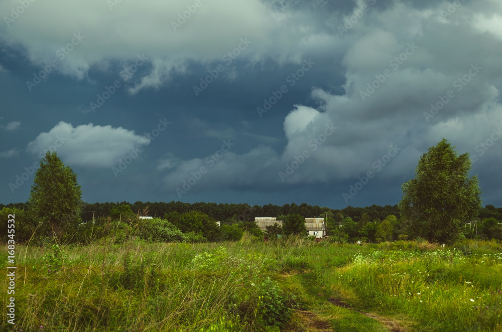 Storm clouds over the field Storm clouds over the field