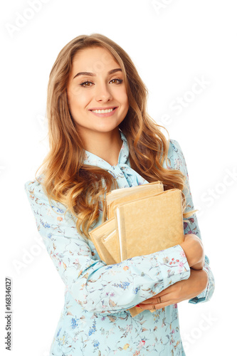 Portrait of a beautiful young student in glasses with books over white background