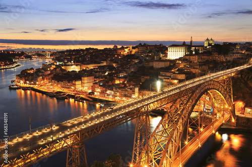 Porto skyline and Douro River at night with Dom Luis I Bridge on the foreground, Portugal