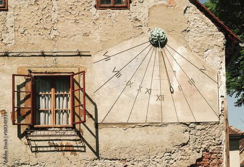 Sun Dial on Outside of Building