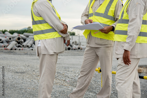 engineering man and senior architecture team project meeting in out door construction site