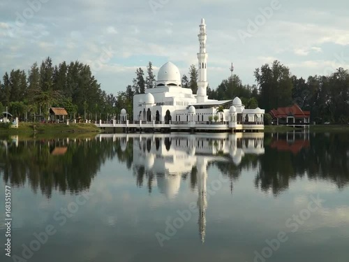 Beautiful scenery of Tengku Tengah Zaharah Mosque or Kuala Ibai Floating Mosque, Kuala Terengganu, Terengganu, Malaysia during the daytime. photo