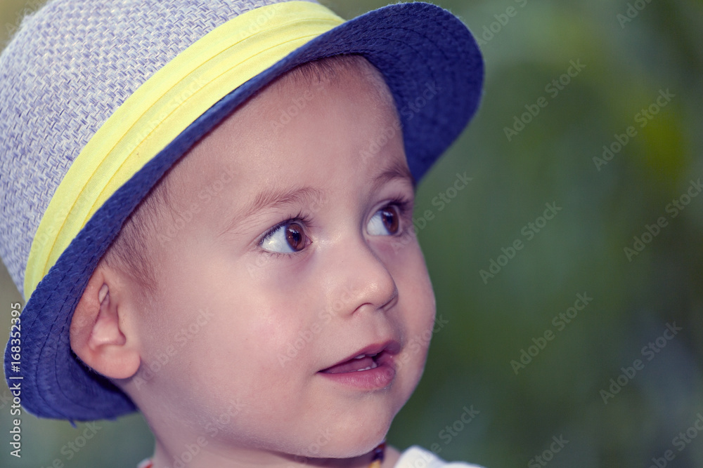 Close up portrait of a sweet little smiling baby boy with a hat Close up portrait of a sweet little smiling baby boy with a hat