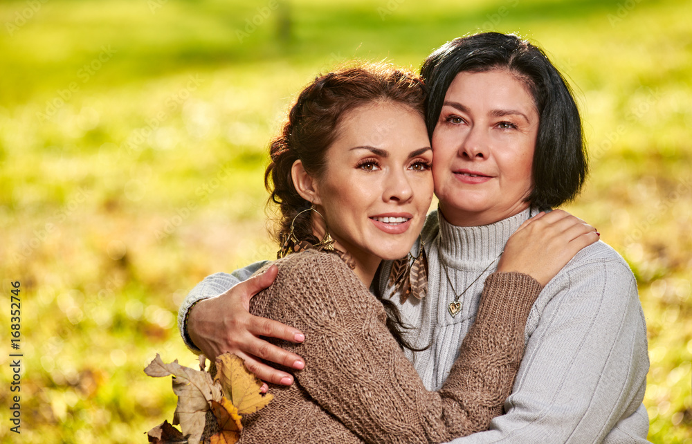 Mother and daughter hugging portrait
