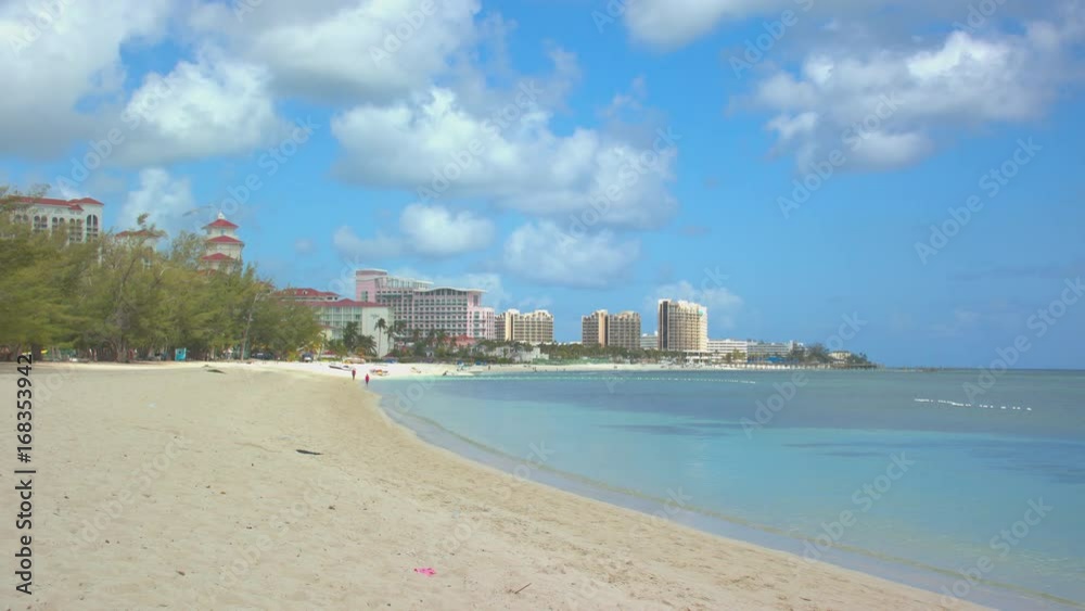Goodman Bay Beach in Nassau Bahamas featuring Beachfront Resort Hotels with Vibrant Colors in a Tropical Setting Goodman Bay Beach in Nassau Bahamas featuring Beachfront Resort Hotels with Vibrant Colors in a Tropical Setting