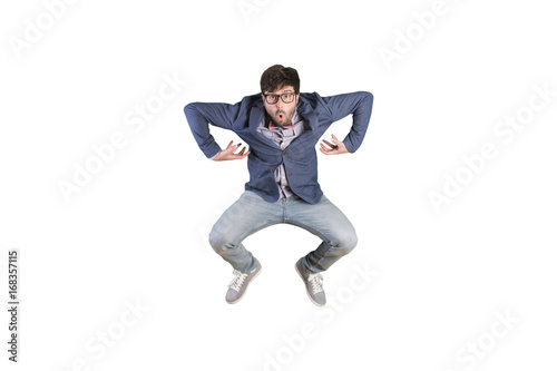 Crazy young businessman jumping. Monkey pose