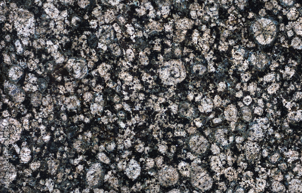 The texture of a black marble stone The texture of a black marble stone