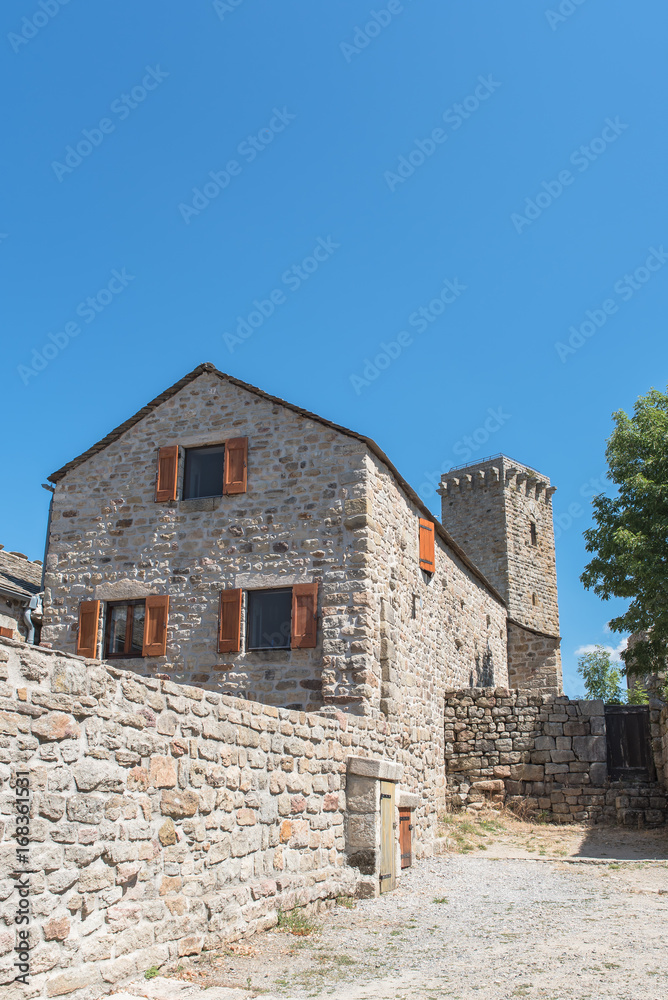 La Garde-Guerin, fortified village in Lozere, tower and old house, in the Cevennes in France
