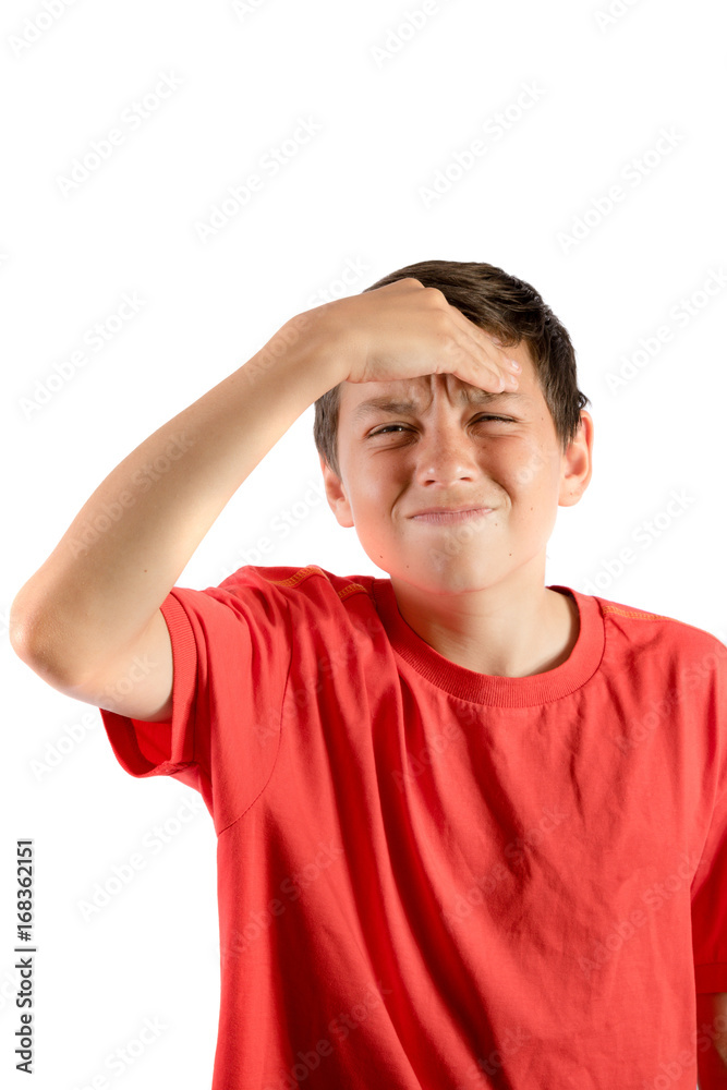 A young teenage boy isolated against white background with a migraine A young teenage boy isolated against white background with a migraine