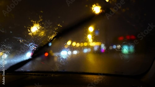 Night ride city car wipers remove heavy rain on windshield 4K