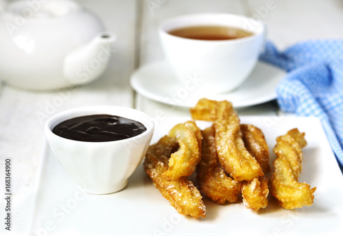 Traditional mexican dessert churros with chocolate sauce