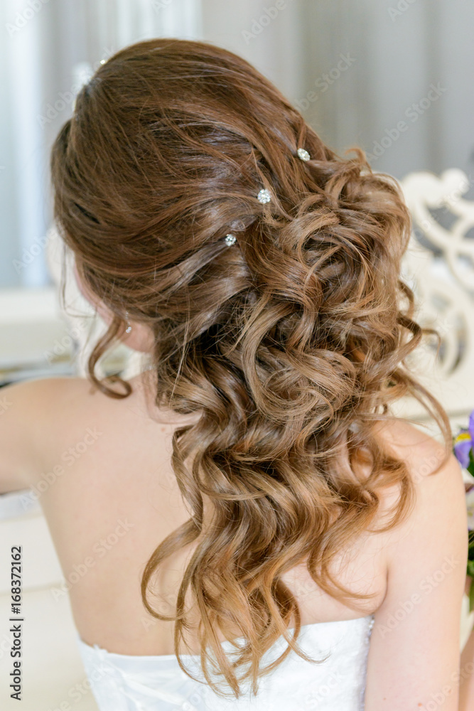 Young attractive bride on wedding gown in studio Young attractive bride on wedding gown in studio