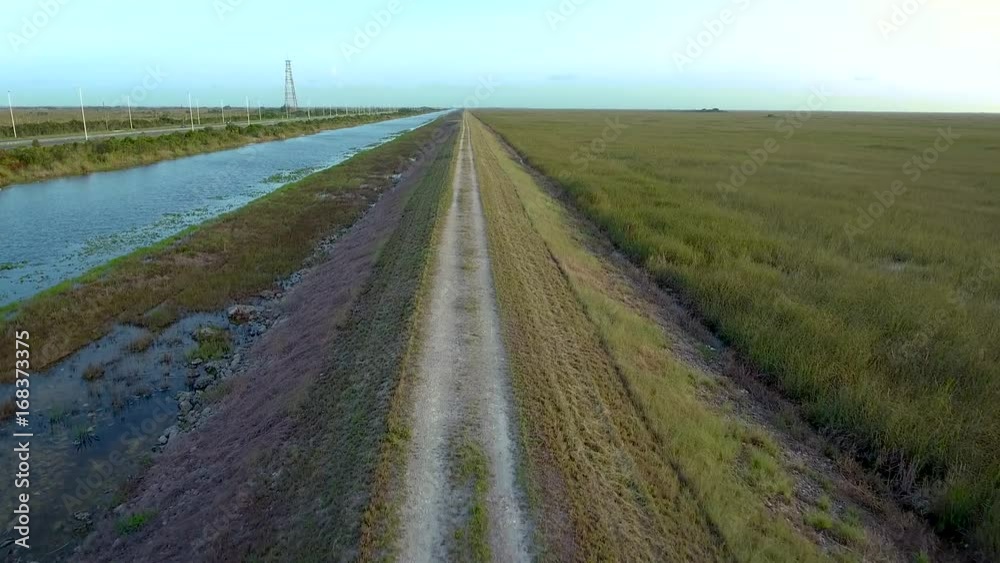 4k Aerial Flight of A Dirt Path By the Canal 4k Aerial Flight of A Dirt Path By the Canal