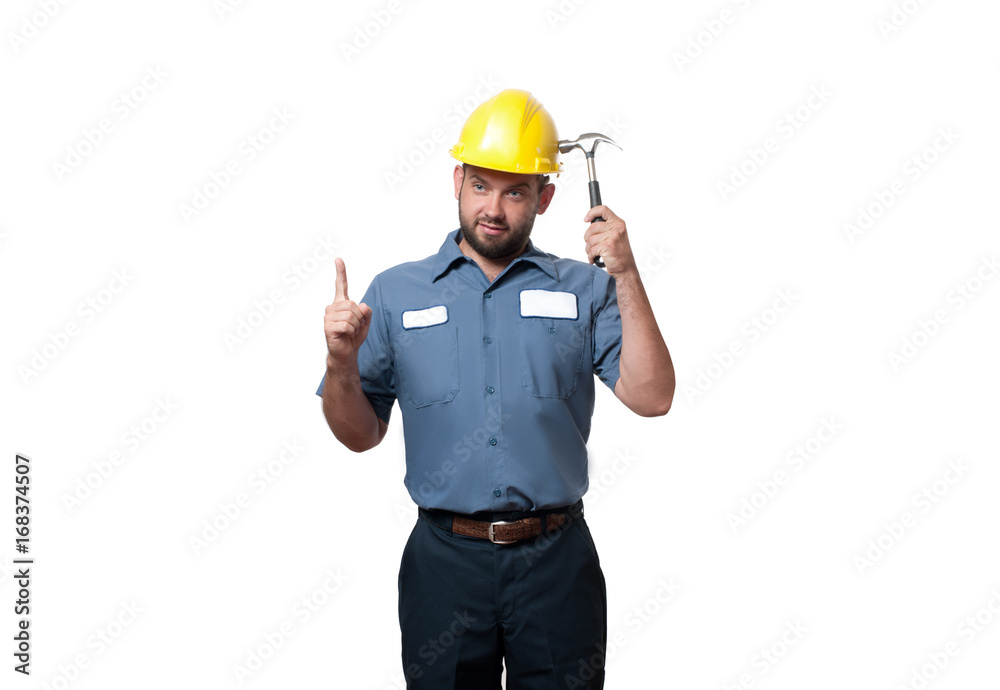 Man in uniform and yellow helmet with hammer Man in uniform and yellow helmet with hammer