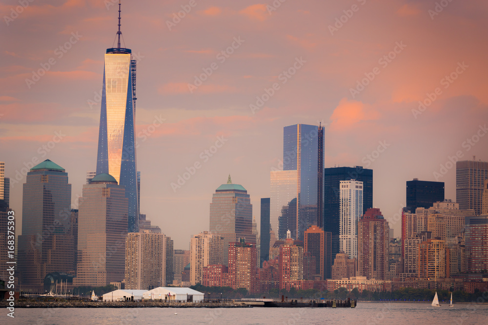 Downtown Manhattan at dusk with pink cloudy sky, New York City.