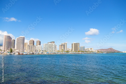 Honolulu cityscape with Diamond Head mountain in a view, Hawaii, USA. A view on Honolulu from the bay in early morning.