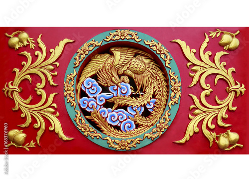 Close up carved phoenix on the wall sculpture in Chinese temple