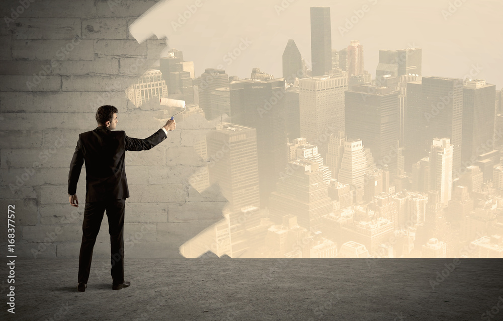 Salesman painting city scape on wall Salesman painting city scape on wall