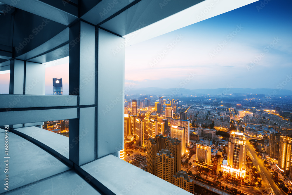 A bird's eye view of the city night view outside the window A bird's eye view of the city night view outside the window