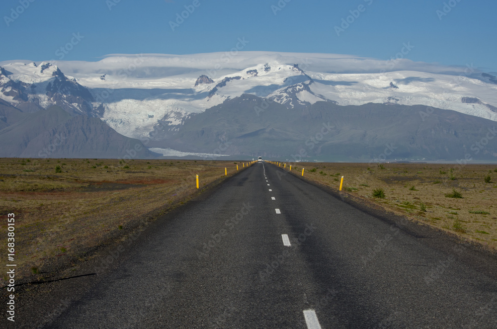 Icelandic highway with distant glaciers
