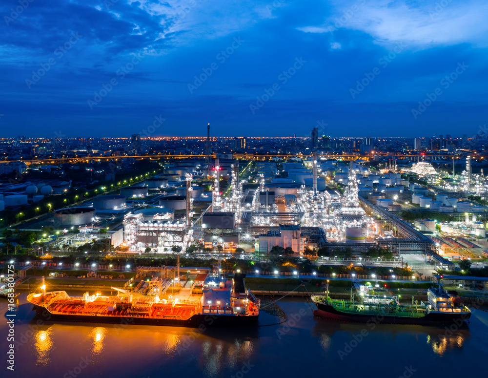 Aerial view of twilight of oil refinery ,Shot from drone of Oil refinery and Petrochemical plant at dusk , Bangkok, Thailand