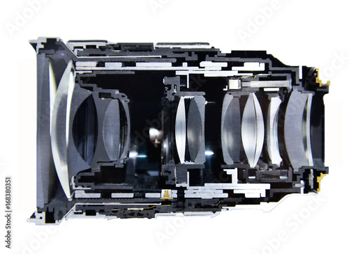 Cut haft cross section camera lens isolated on black background.
