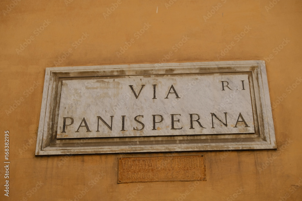 Rome, Italy - August 15, 2017: Via Panisperna street name sign. It is famous for the Via Panisperna boys, group of young scientists led by Enrico Fermi who made in 1934 the discovery of slow neutrons Rome, Italy - August 15, 2017: Via Panisperna street name sign. It is famous for the Via Panisperna boys, group of young scientists led by Enrico Fermi who made in 1934 the discovery of slow neutrons