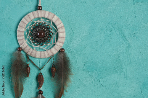 Dream catcher on aquamarine photo