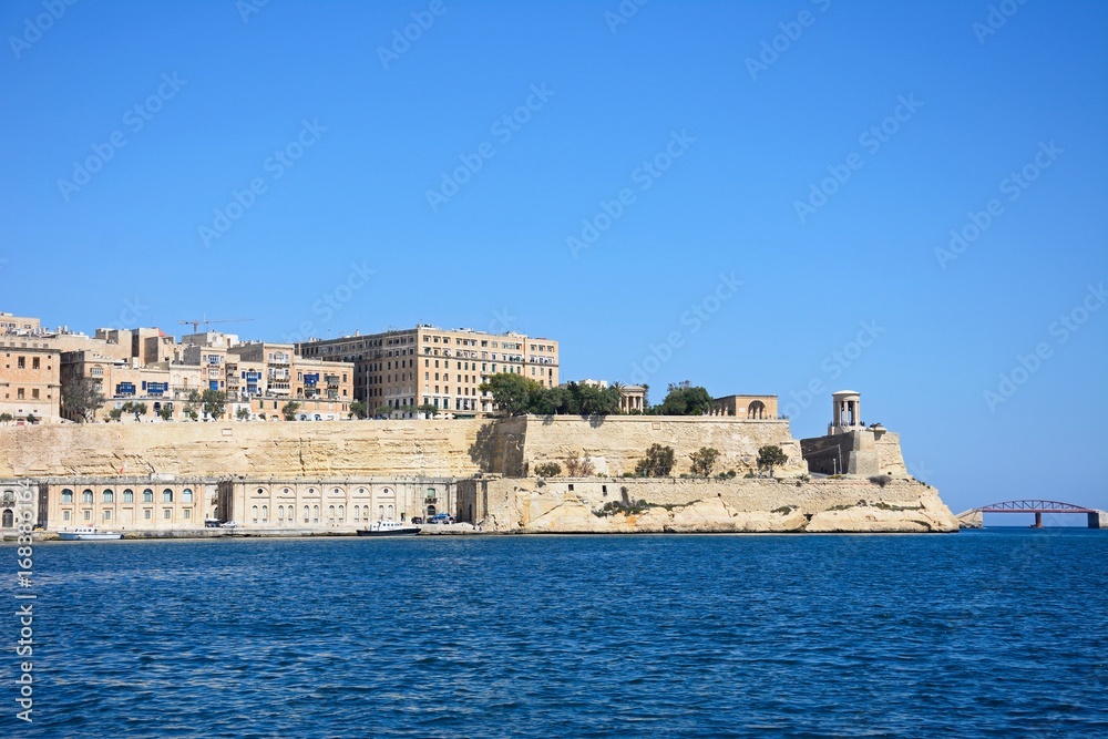Valletta waterfront buildings seen from across the Grand Harbour in Vittoriosa, Malta.