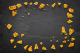 Image of tortilla thips or nachos on slate stone plate