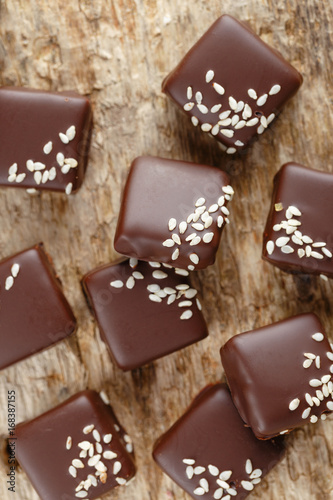 Handmade chocolate candies with sesame seeds