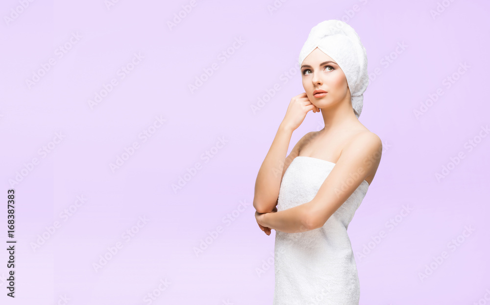Young, beautiful and natural woman in towel. Spa concept with copyspace.